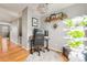 Home office featuring wood floors, indoor garden, and ergonomic desk setup at 5428 Zephyr Ct, Arvada, CO 80002