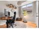 Bright home office with natural light, wood floors, and a comfortable workspace at 5428 Zephyr Ct, Arvada, CO 80002