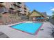 Resort-style pool with ample lounge chairs and umbrellas for relaxing in the sun at 5428 Zephyr Ct, Arvada, CO 80002