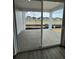 A spacious covered patio through glass doors, perfect for outdoor living and entertaining at 2141 S Irvington St, Aurora, CO 80018