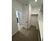 Walk-in closet with ample shelving and hanging space, and doorway to bathroom at 2141 S Irvington St, Aurora, CO 80018