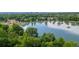 Breathtaking aerial view showcasing the lush greenery and serene lake at 2950 E 17Th Ave, Denver, CO 80206