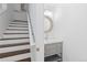 Bathroom with double sinks, gray vanity, and wood and white stairs in background at 2950 E 17Th Ave, Denver, CO 80206