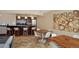 Stylish dining area with modern lighting, wood tables, and tile flooring at 2950 E 17Th Ave, Denver, CO 80206