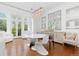 Bright dining area featuring a contemporary light fixture and plenty of natural light at 2950 E 17Th Ave, Denver, CO 80206