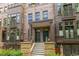 Charming multi-story brick condo with steps leading to a covered entryway, and decorative railings at 2950 E 17Th Ave, Denver, CO 80206