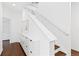 Hallway featuring white stairs, a skylight and modern white storage cabinets at 2950 E 17Th Ave, Denver, CO 80206