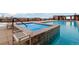 Inviting rooftop pool with an attached hot tub and lounge chairs, offering relaxation with city views at 2950 E 17Th Ave, Denver, CO 80206