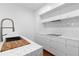 Bright kitchen featuring marble countertops, a marble backsplash, and stainless steel sink at 2950 E 17Th Ave, Denver, CO 80206