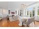 Open-concept living room and dining area with stylish decor, hardwood floors and a fireplace at 2950 E 17Th Ave, Denver, CO 80206