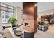 Inviting lounge area with a fireplace, comfortable seating, and ample natural light at 2950 E 17Th Ave, Denver, CO 80206