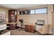 Comfortable office space with built-in bookshelves and a view of the exterior at 2950 E 17Th Ave, Denver, CO 80206