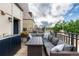 Inviting patio area with outdoor furniture, including a sectional sofa and dining table, perfect for relaxation at 2950 E 17Th Ave, Denver, CO 80206