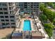 Stunning aerial view of rooftop pool with surrounding lounge area in a modern residential building at 2950 E 17Th Ave, Denver, CO 80206