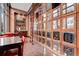 Elegant wine room with ample storage and a ladder for easy access at 2950 E 17Th Ave, Denver, CO 80206