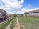 A serene view of the land between houses with mountain views and a wooden fence at 3893 Ute Mountain Trl, Castle Rock, CO 80109