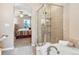 Bathroom showcases a soaking tub, glass shower, and doorway to the main bedroom at 3893 Ute Mountain Trl, Castle Rock, CO 80109