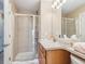 Bright bathroom showcasing a glass enclosed shower, vanity with sink, and modern finishes at 3893 Ute Mountain Trl, Castle Rock, CO 80109