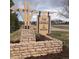 Sign for the Grange at the Meadows community set on a stone base at 3893 Ute Mountain Trl, Castle Rock, CO 80109