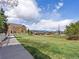 Landscaped community with sidewalk and green space at 3893 Ute Mountain Trl, Castle Rock, CO 80109