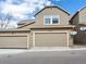 A modern two-story home with a two-car garage and neutral-colored exterior at 3893 Ute Mountain Trl, Castle Rock, CO 80109