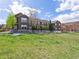 Exterior view of townhome community with manicured lawns and walkways at 3893 Ute Mountain Trl, Castle Rock, CO 80109