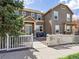 Charming two-story home featuring a welcoming front porch and a manicured front yard with a white picket fence at 3893 Ute Mountain Trl, Castle Rock, CO 80109