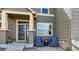 Inviting covered front porch with seating offers a cozy welcome to this charming home at 3893 Ute Mountain Trl, Castle Rock, CO 80109