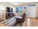 The living room features a cozy leather sofa, TV, and a large window at 3893 Ute Mountain Trl, Castle Rock, CO 80109