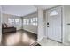 Welcoming entryway with hardwood floors and a bright front door at 1700 W Stoll Pl, Denver, CO 80221