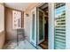 Spacious balcony with seating and nice view through open door at 2200 S University Blvd # 212, Denver, CO 80210