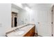 Bathroom featuring dual sinks, spacious countertops, and a large mirror at 2200 S University Blvd # 212, Denver, CO 80210