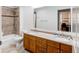 Bathroom features a double vanity, bathtub, and large mirror at 2200 S University Blvd # 212, Denver, CO 80210