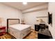Comfortable bedroom with a queen bed and two side tables with lamps at 2200 S University Blvd # 212, Denver, CO 80210