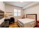 Cozy bedroom features a comfortable bed, ample storage, and lots of natural light at 2200 S University Blvd # 212, Denver, CO 80210