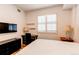 Bedroom featuring a desk, dresser and a comfortable bed with storage at 2200 S University Blvd # 212, Denver, CO 80210