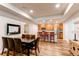 An open layout features a dining area with seating at the breakfast bar plus a full table at 2200 S University Blvd # 212, Denver, CO 80210