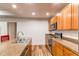 Kitchen area with sleek appliances and granite countertops that flow into the dining area at 2200 S University Blvd # 212, Denver, CO 80210
