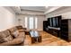 Cozy living room with lots of natural light and a media center for easy entertaining at 2200 S University Blvd # 212, Denver, CO 80210