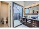 Stylish bathroom showcasing dual vessel sinks, a framed glass shower, and modern finishes at 27732 Squaw Pass Rd, Evergreen, CO 80439