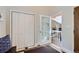 Bright foyer featuring a closet and a doorway leading to a living area with a stone fireplace at 27732 Squaw Pass Rd, Evergreen, CO 80439