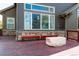 Spacious backyard deck with a fire pit and seating offers a perfect spot for outdoor relaxation and entertainment at 25871 E 5Th Pl, Aurora, CO 80018
