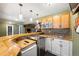 Entertaining bar area with wooden countertop, sink, microwave, mini refrigerator and beer tap in basement at 25871 E 5Th Pl, Aurora, CO 80018