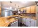 Basement kitchenette boasting custom wooden countertops and bar setup, perfect for hosting gatherings at 25871 E 5Th Pl, Aurora, CO 80018