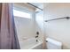 Bright bathroom with a tiled shower, bathtub and a compact toilet for efficient use of space at 25871 E 5Th Pl, Aurora, CO 80018