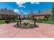Community entrance featuring landscaping, benches, walking paths, and a decorative central island, creating a welcoming atmosphere at 25871 E 5Th Pl, Aurora, CO 80018