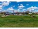 Vibrant community park featuring lush green spaces and a playground, creating a recreational space for neighborhood residents at 25871 E 5Th Pl, Aurora, CO 80018