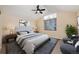 Bright main bedroom with a vaulted ceiling, accent wall, and a view to the outside at 25871 E 5Th Pl, Aurora, CO 80018