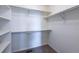 Walk-in closet with carpeted floor, shelving, and metal racks at 25871 E 5Th Pl, Aurora, CO 80018