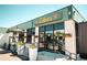 Charming exterior view of Ester's building, featuring flowers and sleek design at 2700 S Holly St # 115, Denver, CO 80222